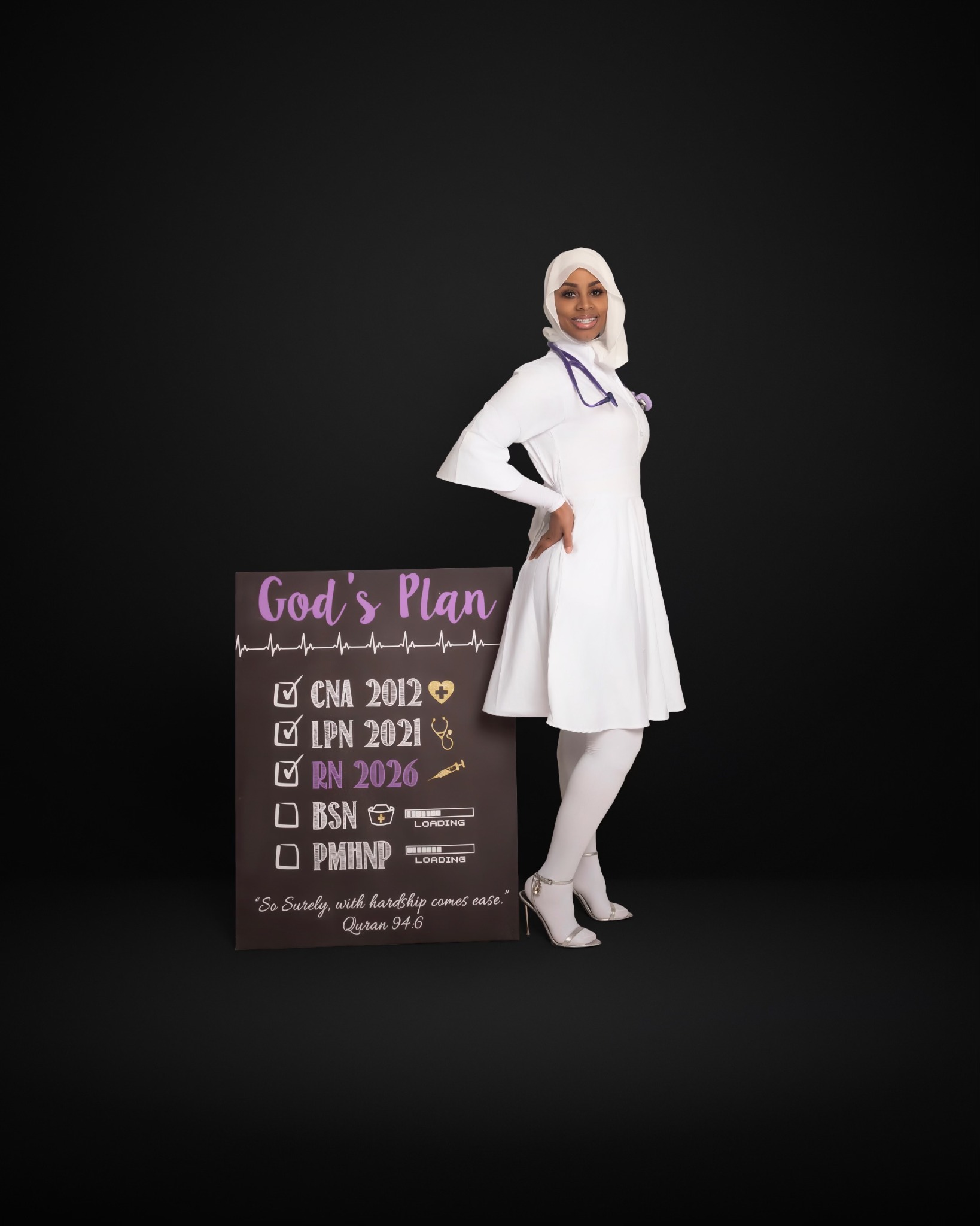 Ny’Rossha Alim in nursing attire beside a sign marking her journey from CNA to RN and her BSN and PMHNP goals